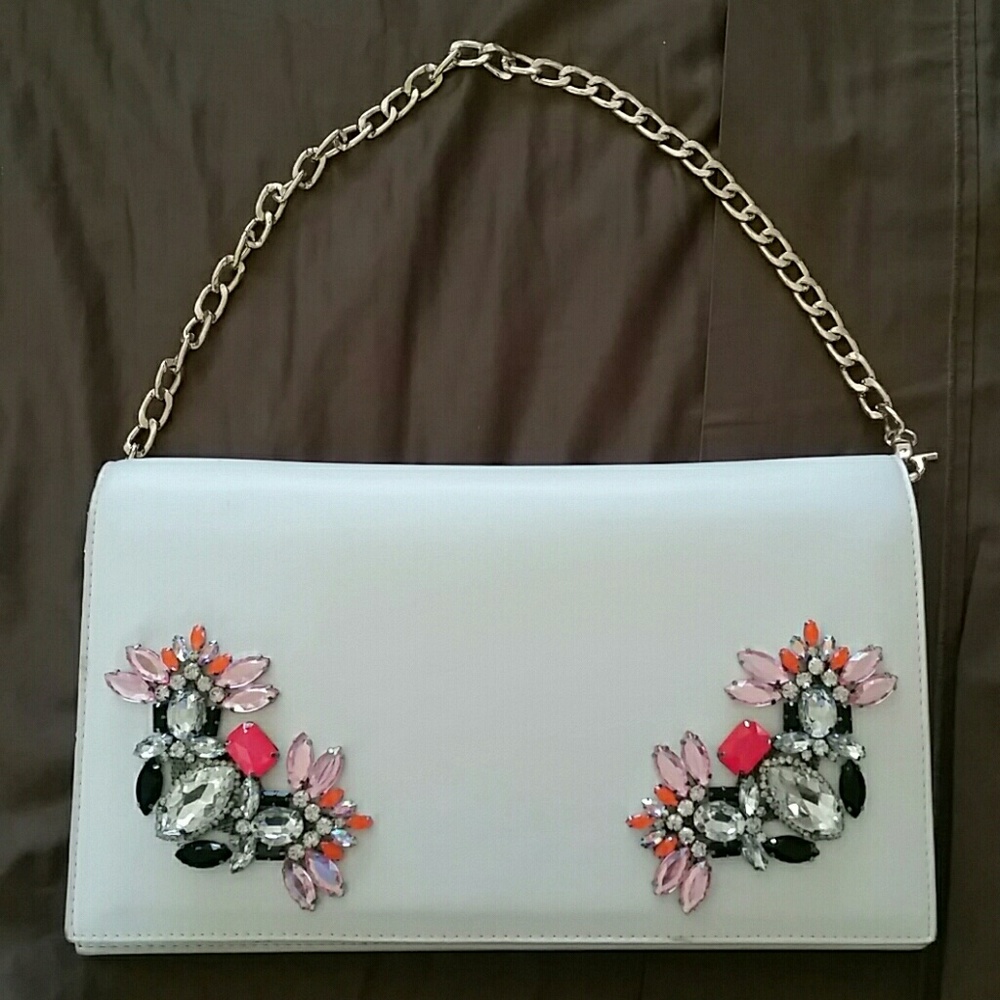 Bebe clutch with chain and jeweled embellishments